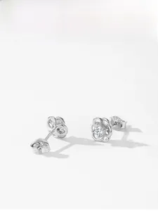 Detailed view of S925 sterling silver flower earrings with hollow petals and zircon center