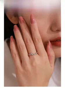 Close-up of 925 sterling silver snake-shaped ring with textured twist design on model
