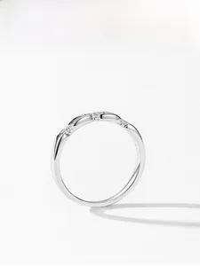 Close-up of S925 sterling silver wavy ring featuring three inlaid zircon stones