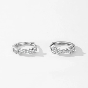 Elegant S925 sterling silver bow hoop earrings with sparkling pave-set zircons on white