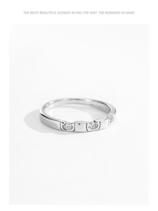 Close-up of a minimalist S925 sterling silver ring with three round cubic zirconia stones