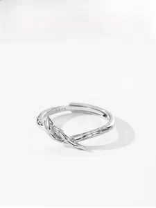 Macro detail of S925 sterling silver snake ring showing scale texture and inner hallmark