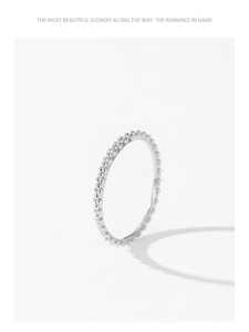 Detail of S925 sterling silver beaded eternity ring with polished metallic shine