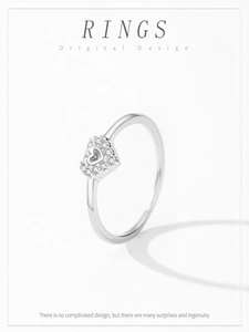 Macro detail of S925 sterling silver hollow heart ring featuring sparkling zircon pavé