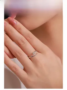 Detail of adjustable 925 sterling silver snake ring with marquise cut zircon on finger