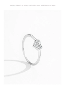 Macro shot of S925 sterling silver ring with hollow heart-shaped pavé cubic zirconia setting