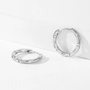 Elegant S925 sterling silver hoop earrings with wavy texture and micro-set cubic zirconia