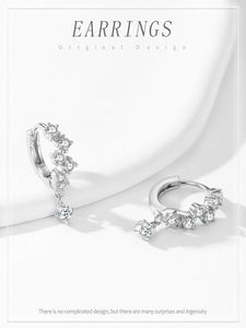 Macro detail of S925 sterling silver hoop earrings featuring sparkling zircon stone pavé