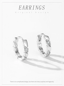 Detailed close-up of S925 sterling silver geometric earrings with inlaid cubic zirconia