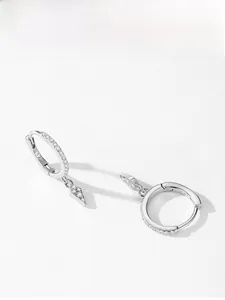 Macro shot of S925 sterling silver hoop earrings with geometric rhombus pendants