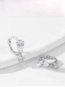 Close-up of S925 sterling silver pear-cut zircon earrings with macro hallmark detail