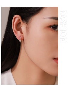 Close-up of elegant S925 sterling silver star earrings with pave cubic zirconia crystals