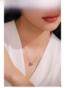 Close-up of S925 silver necklace with micro-paved ice cube pendant on a model