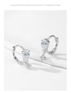 Detailed macro of S925 sterling silver hoop earrings with pear-cut zircon stones