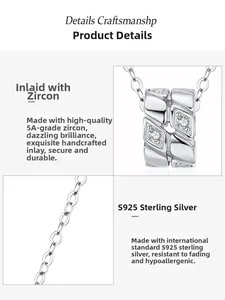 Macro detail of S925 sterling silver cylinder pendant with inlaid 5A cubic zirconia stones