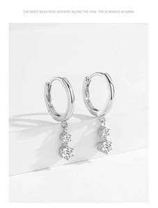 Detail view of S925 sterling silver hoop earrings with dual hanging cubic zirconia stones