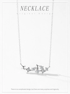 Detail of 925 silver necklace featuring star-shaped pendants with sparkling zircons