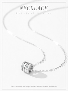 Detail of 925 silver cylinder necklace with hollow stars and sparkling zircon inlay