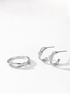 Detail view of S925 sterling silver heart zircon ring and matching C-shape earrings