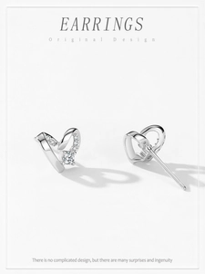 Detail view of S925 silver heart stud earrings with sparkling cubic zirconia stones