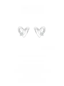 Detailed close-up of hollow silver heart stud earrings with sparkling zircon accents