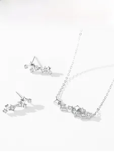 Close-up of S925 silver star necklace and earrings set with micro-pave cubic zirconia