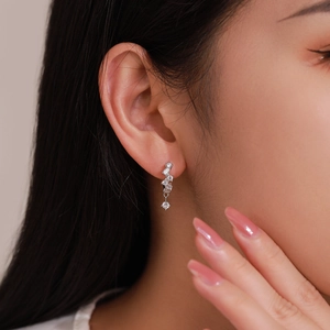 925 sterling silver drop earrings with sparkling cubic zirconia on a female ear