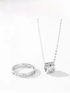 Detailed macro view of S925 sterling silver necklace and ring set with cubic zirconia