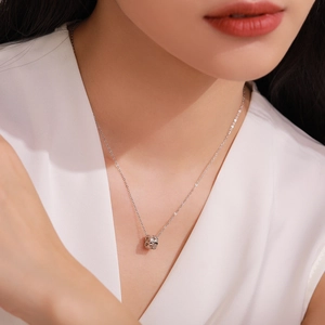 Elegant S925 sterling silver geometric cylinder pendant necklace worn by a model
