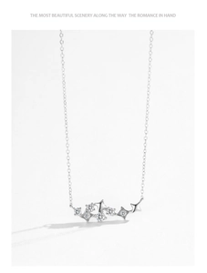 Macro detail of 925 sterling silver star necklace with sparkling zircon pavé setting