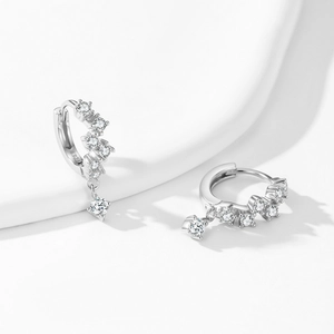 Sparkling 925 sterling silver hoop earrings with square zircon drops on white backdrop