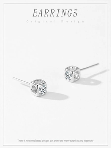 Detail of square S925 silver stud earrings featuring a sparkling centered zircon