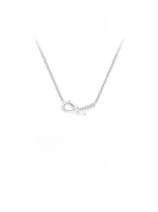 Macro shot of S925 silver necklace featuring a bow knot pendant with micro-inlaid stones