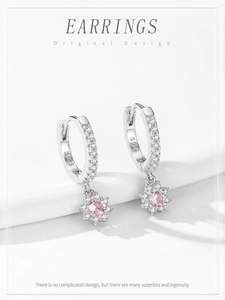 Detail of S925 sterling silver flower earrings with pink zircon and hallmark