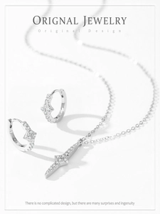 Macro shot of S925 sterling silver star jewelry set with sparkling zircon inlays