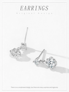 Macro view of 925 sterling silver twin flower earrings with sparkling zircon stones