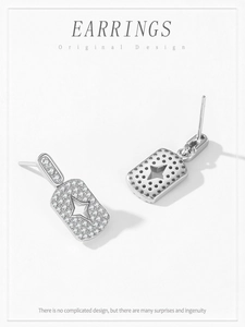 Detailansicht der 925er Sterlingsilber-Ohrringe mit Zirkonia-Steinen und Stern-Design