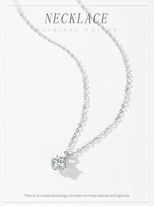 Macro shot of S925 sterling silver necklace with six-claw flower setting solitaire pendant