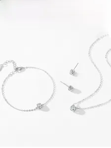 Macro detail of S925 sterling silver cube jewelry set with sparkling zircon stones