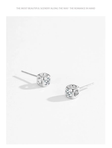 Macro shot of S925 sterling silver square stud earrings with sparkling round cubic zirconia