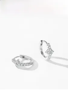 Detailed view of S925 sterling silver earrings with star shape and sparkling zircon stones