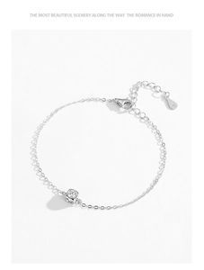 Detail of S925 sterling silver stamp on minimalist chain bracelet with square zircon