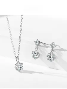 Detailed view of 925 sterling silver twin-flower jewelry set with brilliant cubic zirconia