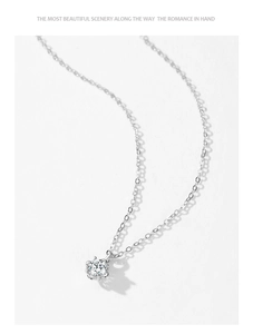 Detailed view of 925 sterling silver flower necklace pendant with six-prong zircon setting