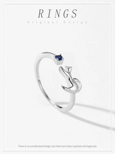 Macro detail of S925 sterling silver kitten ring with a deep blue sapphire gemstone
