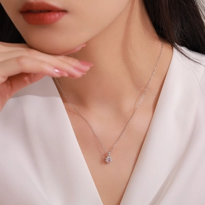 Elegant 925 sterling silver snowflake necklace with pink zircon on a model neck