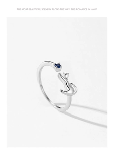Detailed view of S925 silver cat ring with blue sapphire and adjustable open band