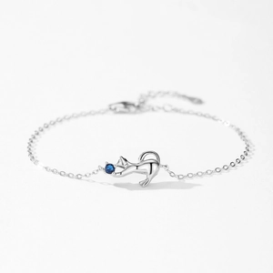 S925 sterling silver cat bracelet with blue stone pendant on a minimalist white background