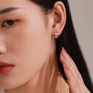 925 sterling silver geometric C-shape hoop earrings with rectangular zircon on a model