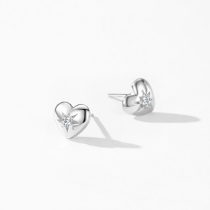Elegant 925 sterling silver heart stud earrings with sparkling starburst zircon center